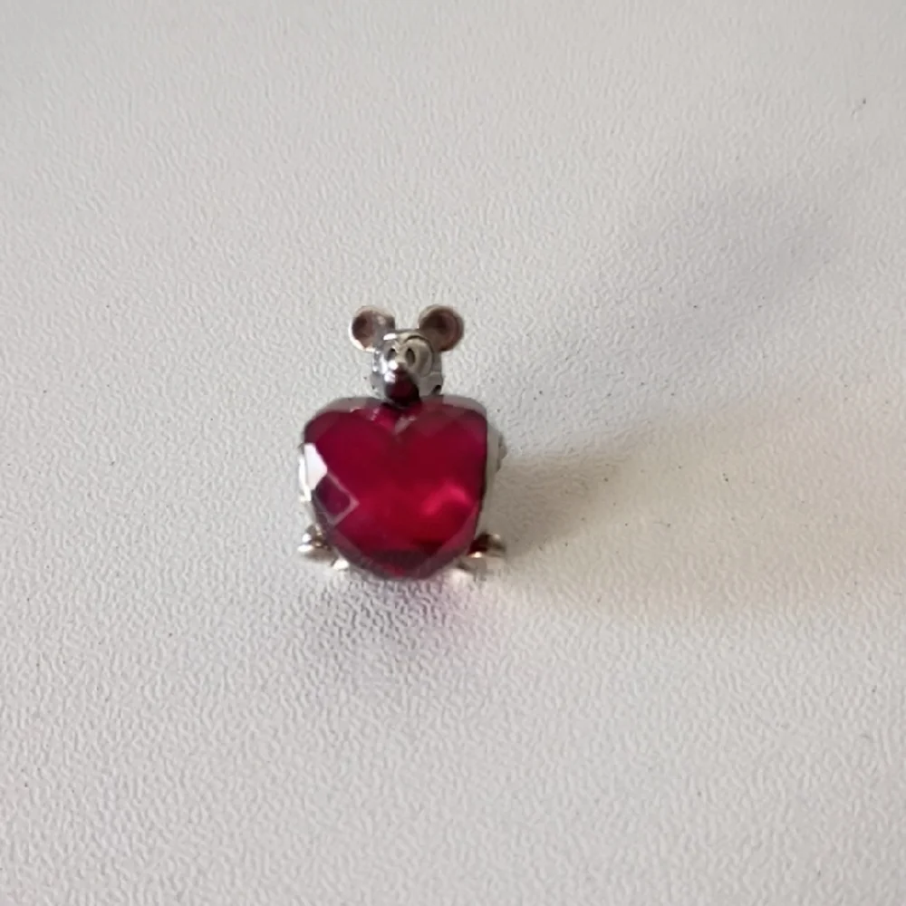 Pandora Disney Mickey Mouse Heart charm featuring a fuchsia crystal.